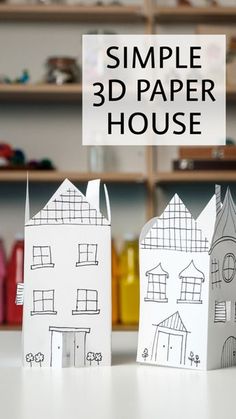 three paper houses sitting on top of a table with the words, simple 3d paper house