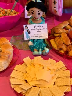 a table topped with lots of different types of food and desserts next to each other