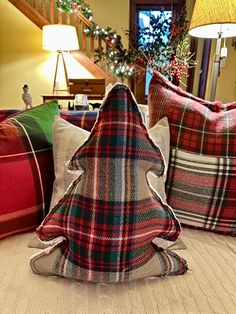 a christmas tree made out of plaid pillows