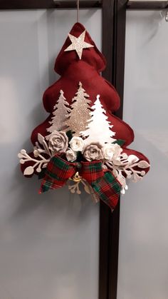 a christmas tree decoration hanging on a wall