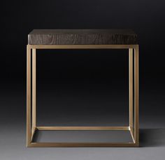 a wooden and metal side table against a black background