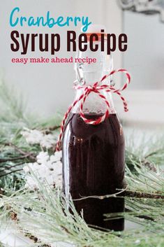 cranberry syrup recipe in a glass bottle with red and white ribbon on top