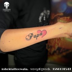 a person with a tattoo on their arm that says papa and has a heart in the middle