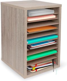 a wooden shelf with many files and folders on it's bottom shelf,