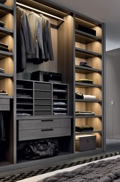 an organized closet with clothes and shoes