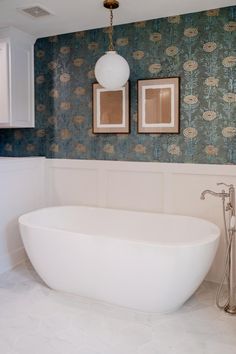 Wallpaper in Bathroom - Pendant Over Bath - White Wainscoting - Faux Marble Tile Primary Bath Design - Moody Bathroom - Master Bathroom - Soaker Tub - Mixed Metal Bathroom Faux Marble Tile, Mixed Metal Bathroom, Wallpaper In Bathroom, Rehab House, Moody Bathroom, White Wainscoting, Bathroom Master