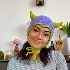 a woman wearing a knitted hat with horns