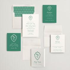 the wedding stationery is green and white