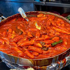 a large metal pan filled with lots of food