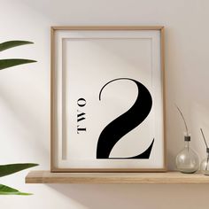 a black and white print with the letter s on it next to two vases