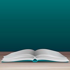 an open book sitting on top of a wooden table next to a green wall and floor