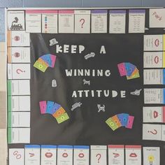 a bulletin board that says keep a winning attitude