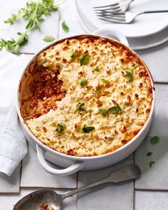 a casserole dish with cheese and herbs