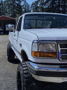 the front end of a white pickup truck