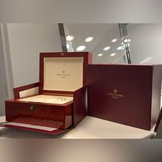 Original Patek Philippe Wooden Watch Box Excellent Condition Luxury Jewelry With Gift Box, Timeless Jewelry In Original Box For Gift, Timeless Jewelry In Original Box As Gift, Timeless Watch With Original Box As Gift, Rectangular Watches With Original Box As Gift, Luxury Red Business Watches, Classic Red Watch As Gift, Classic Red Watch As A Gift, Classic Red Watches As Gift