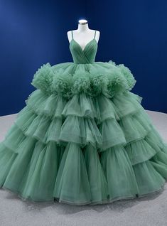 Made from sparkling metal lace covered in tiny twinkling stones in silver or gold, this stylish dress is perfect for an extravagant prom gown, or a classy black tie night look. Wedding Dresses Spaghetti Strap, Green Ball Gown, Green Evening Gowns, Tiered Prom Dress, Ballroom Gowns, Green Princess, Ruffle Prom Dress, Latest Dress Design, Green Tulle