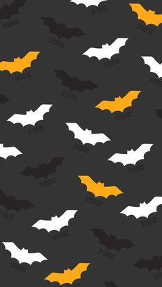 an image of bats flying in the air with yellow and white on black background for halloween wallpaper