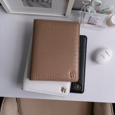 two wallets sitting next to each other on a table