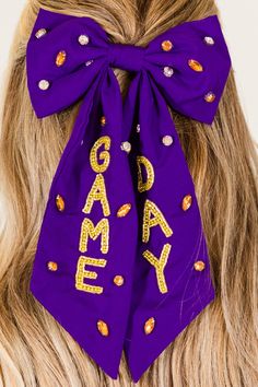 Score a game day with this bow! The purple bow is embellished with beaded lettering and sparkly rhinestones, making it the perfect accessory for your game day look! Don't leave your luck up to chance, grab this playful and fun bow today! Jumpsuit Party, Purple Bows, Tunic Sweatshirt, Babydoll Top, Fall Shopping, Skirt Leggings, Long Cardigan, Long Sleeve Cardigan, Hoodie Top