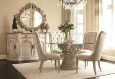 a dining room table with chairs and a chandelier