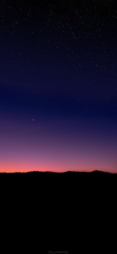 the night sky is lit up with stars and planets in the distance, as seen from an airplane