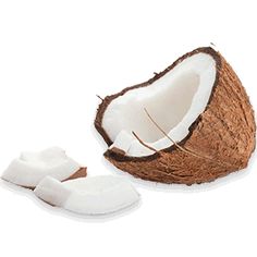 a cut in half coconut sitting on top of it's peels next to another one