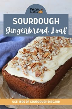 a loaf of sourdough gingerbread bread with white frosting and pecans on top