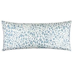 a blue and white leopard print pillow on a white background