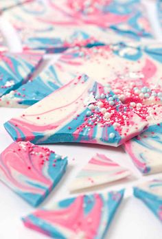 pink, blue and white marbled paper with sprinkles on it's edges