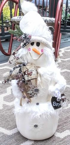 a snowman statue sitting on top of a rug