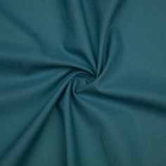 a close up shot of the fabric in teal green color, with very thin lines