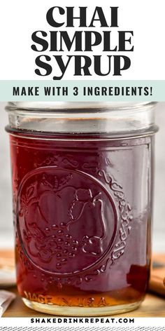 a jar filled with homemade chai syrup on top of a cutting board