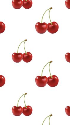 several cherries on a white background with green stems