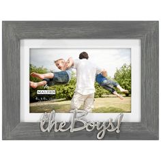 Display a fun photo of the active boys in your life in this stylish picture frame. The gray textured wood frame accented with a matte silver attachment reading "The boys!" is perfect for photos of father and son, brothers, grandsons or best pals. The versatile frame holds a 5x7 photo without the included mat or a 4x6 with the mat. Makes a great gift for a birthday, Mother's Day, Father's Day or just because. | Gray wood picture frame features fun phrase in matte silver lettering attachment. | On Display Easel, Wood Photo Frame, Mdf Frame, Back Pictures, Wall Frames, Boy Pictures, Collage Frames, Picture On Wood, Wood Picture Frames