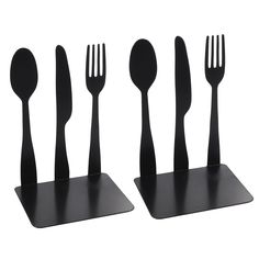 four forks, spoons and knives are arranged in the shape of utensils