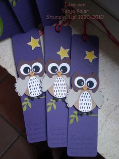 three purple bookmarks with owls and stars on them, sitting next to each other