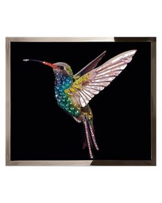 a colorful hummingbird is flying in the air