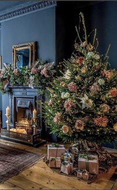 a living room filled with furniture and a christmas tree in the middle of the room