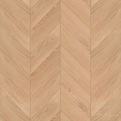 an image of wood flooring that looks like chevroned herringbones in light brown