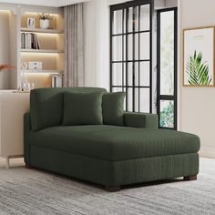 a living room with a large green couch