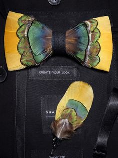 A luxurious feather bow tie with scalloped edges and a blend of yellow, green, and blue shades is displayed on a black coat. Hand Work For Kids, Feather Bowtie, Black Tie Wedding Attire, Husband Fashion, Clothing Diys, Groomsmen Tie, Mardi Gras Wedding, Feather Bow Ties, Costume College