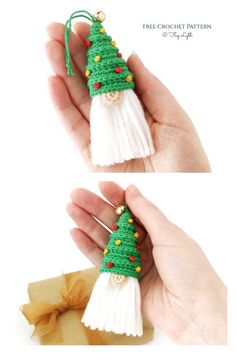 a hand holding a small green and white christmas tree ornament