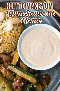 a plate with rice, vegetables and sauce on it that says how to make yum sauce at home