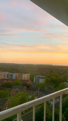 a balcony overlooking the city at sunset or dawn with no one in sight on it