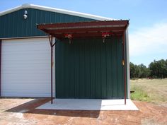 an empty garage with two doors open on the side