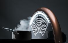 a frying pan with steam coming out of it next to a stove top oven