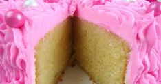 a close up of a cake with pink frosting