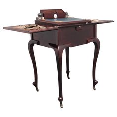 an old fashioned desk with drawers and keys on the top, sitting in front of a white background