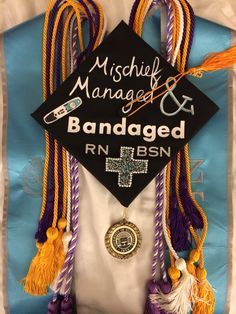 a decorated graduation cap and tassels with the words, mischef managed & damaged on it