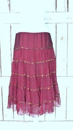 "Vintage sheer silk dark red ruffle midi skirt/mid length tiered festival skirt/90s burgundy/maroon silk skirt/large Features... -sheer 100% overlay -accented with metallic gold threading -stretch poly lining -midi length -zipper side -90's vintage Measurements...taken flat -marked size: large -across waist: 18\" -length: 29\" Condition... -excellent vintage condition -minimal wear UJ2065" Fall Tiered Ruffled Skirt, Festive Ruffled Tiered Skirt Dresses, Festive Tiered Ruffled Skirt Dresses, Elegant Tiered Summer Skirt, Festive Elegant Ruffled Skirt, Fitted Tiered Skirt Dress For Festivals, Fitted Flared Skirt For Festivals, Bohemian Full Skirt Bottoms For Party, Bohemian Fall Party Skirt